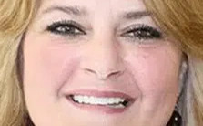 After dental veneers treatment – woman smiling with bright, even teeth